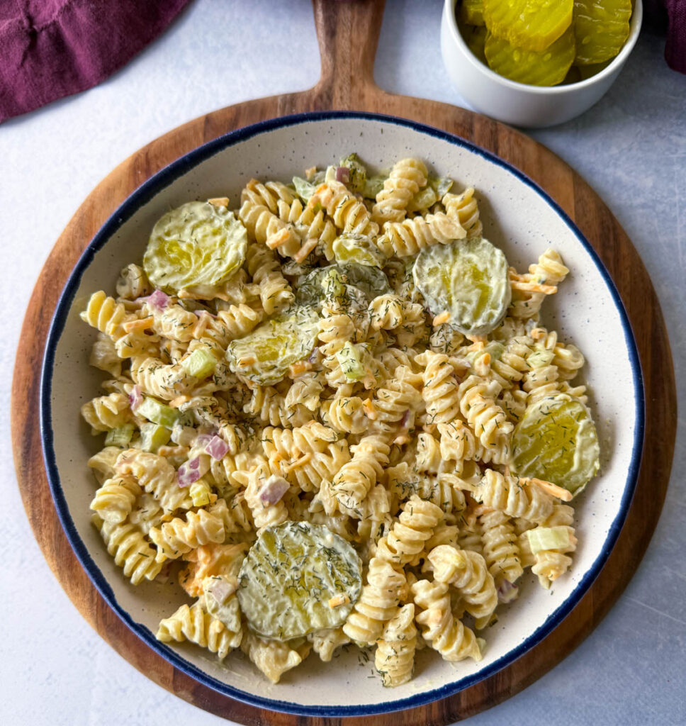 dill pickle pasta salad in a white bowl