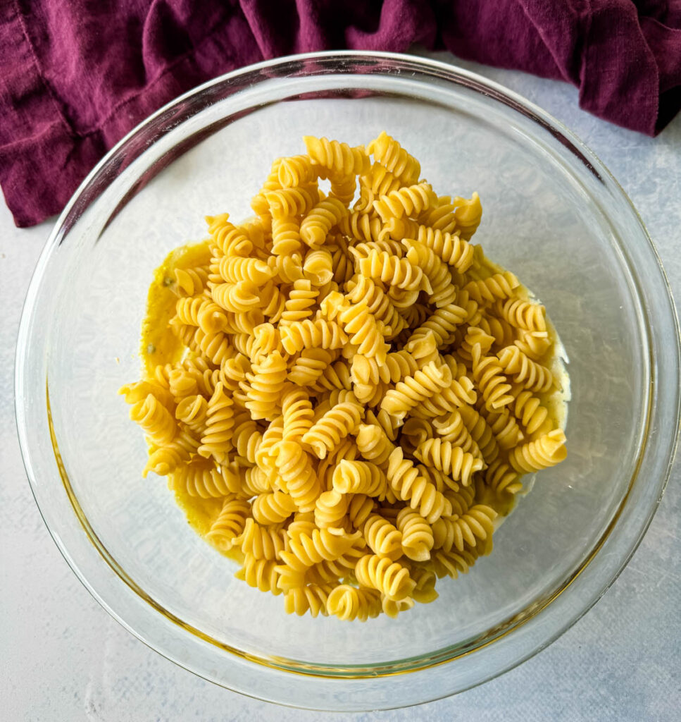 cooked rotini pasta in a glass bowl