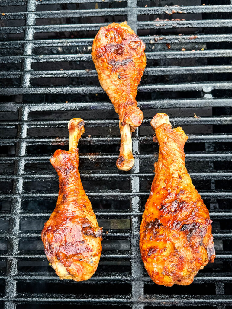 cooked crispy turkey legs on a grill