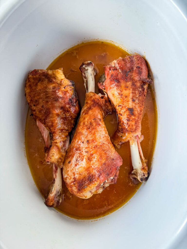 smoked turkey legs in a slow cooker