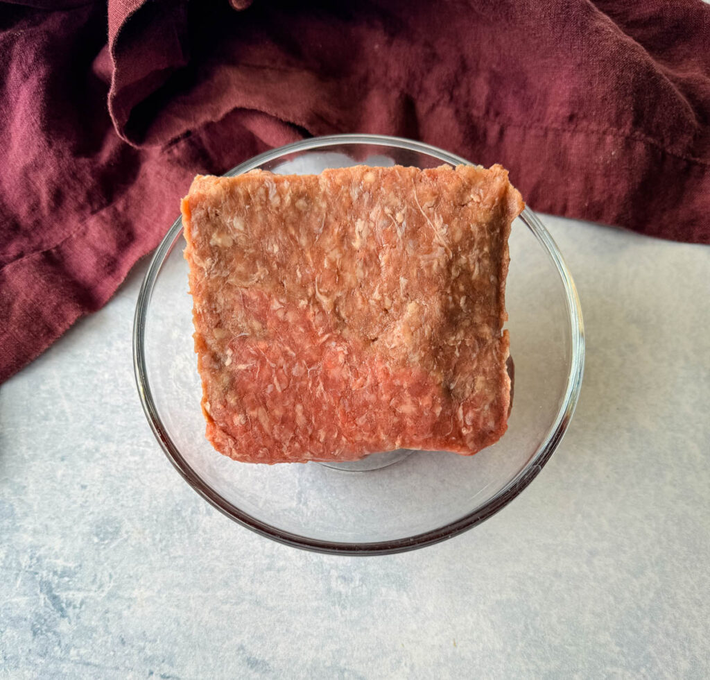 raw ground beef in a glass bowl