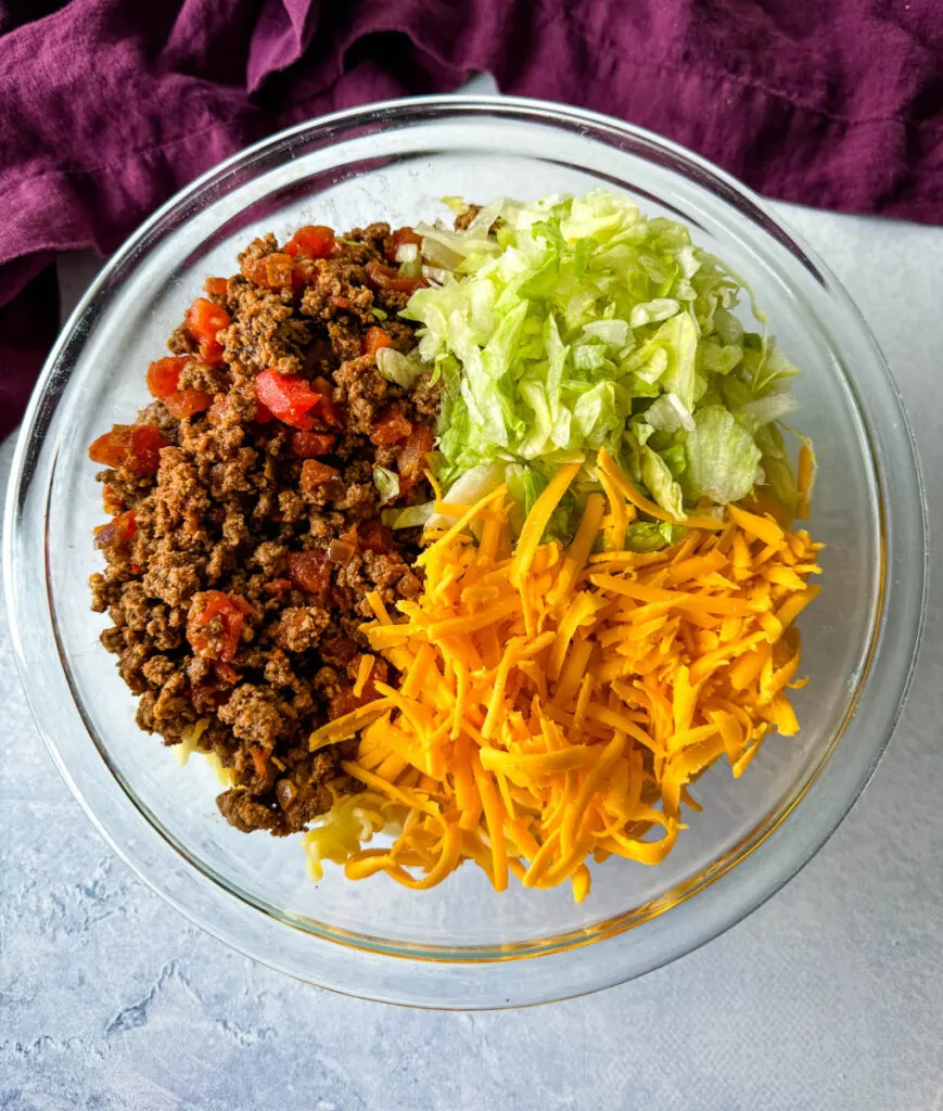 taco pasta salad with ground beef in a glass bowl