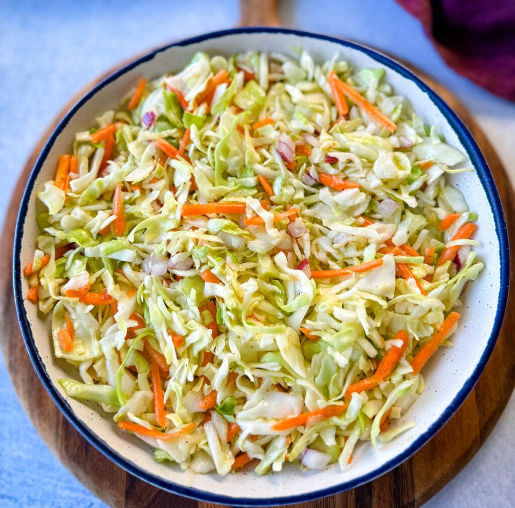 vinegar coleslaw made without mayo in a white bowl