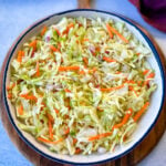 vinegar coleslaw made without mayo in a white bowl