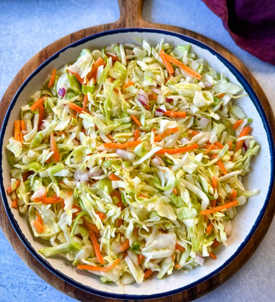 vinegar coleslaw made without mayo in a white bowl