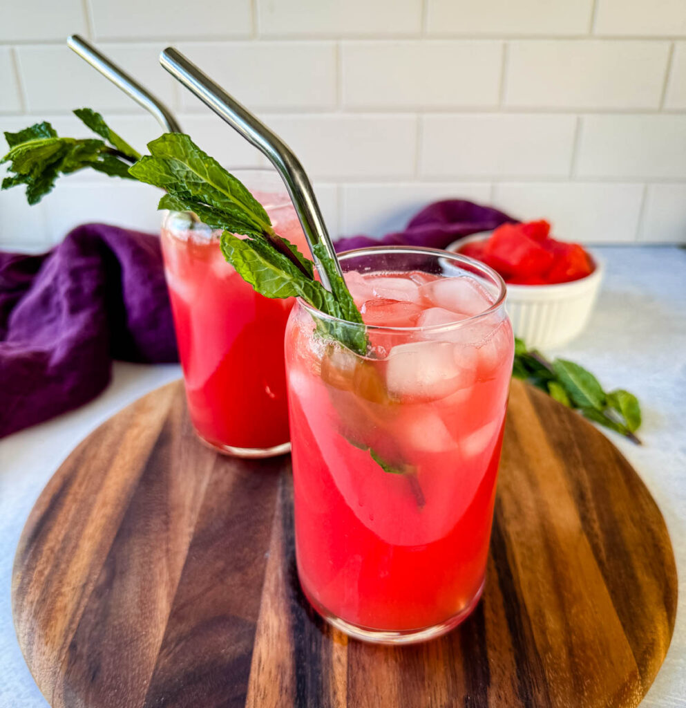 watermelon water in a glass with fresh mint and ice cubes