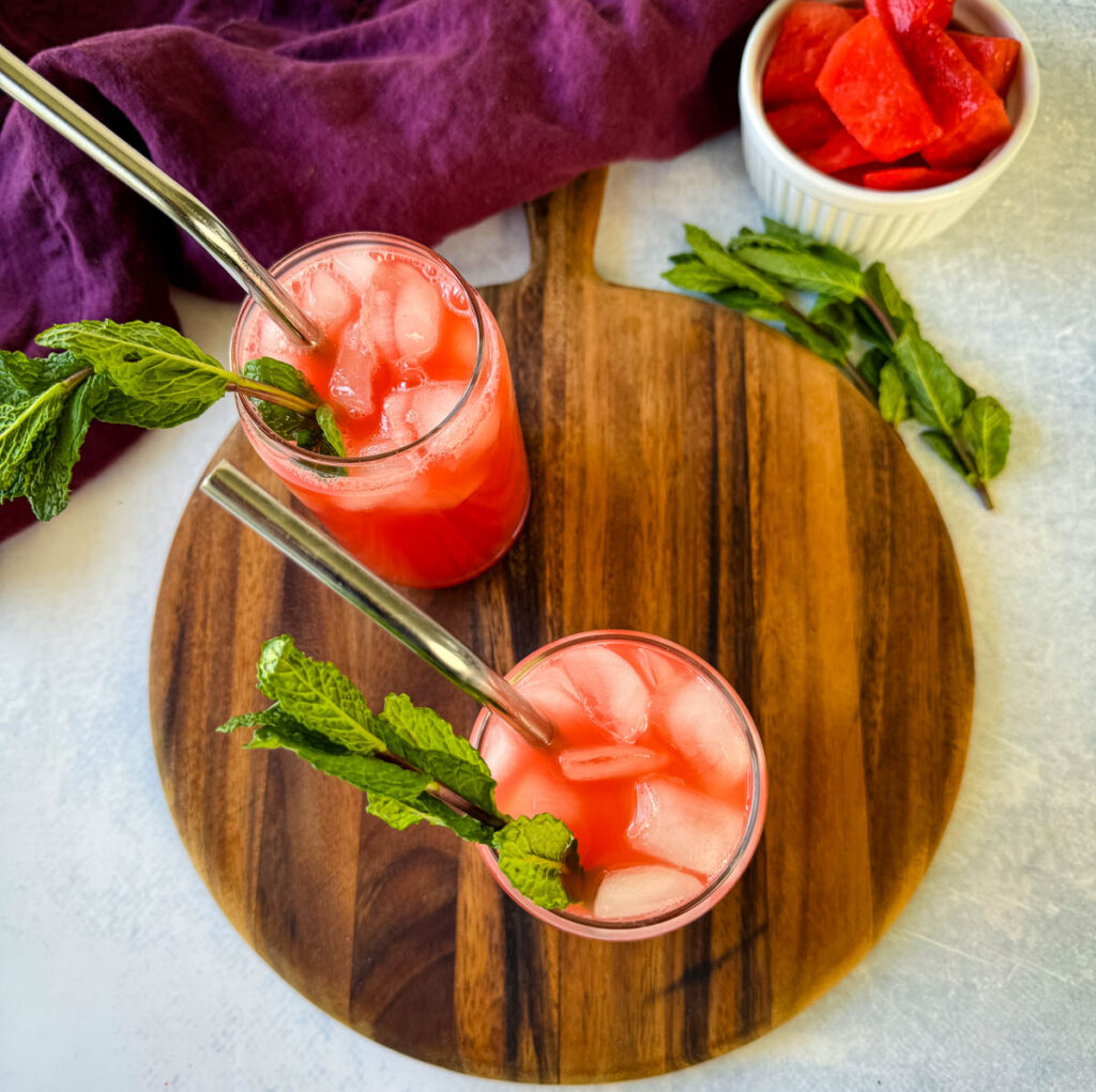 watermelon water in a glass with fresh mint and ice cubes