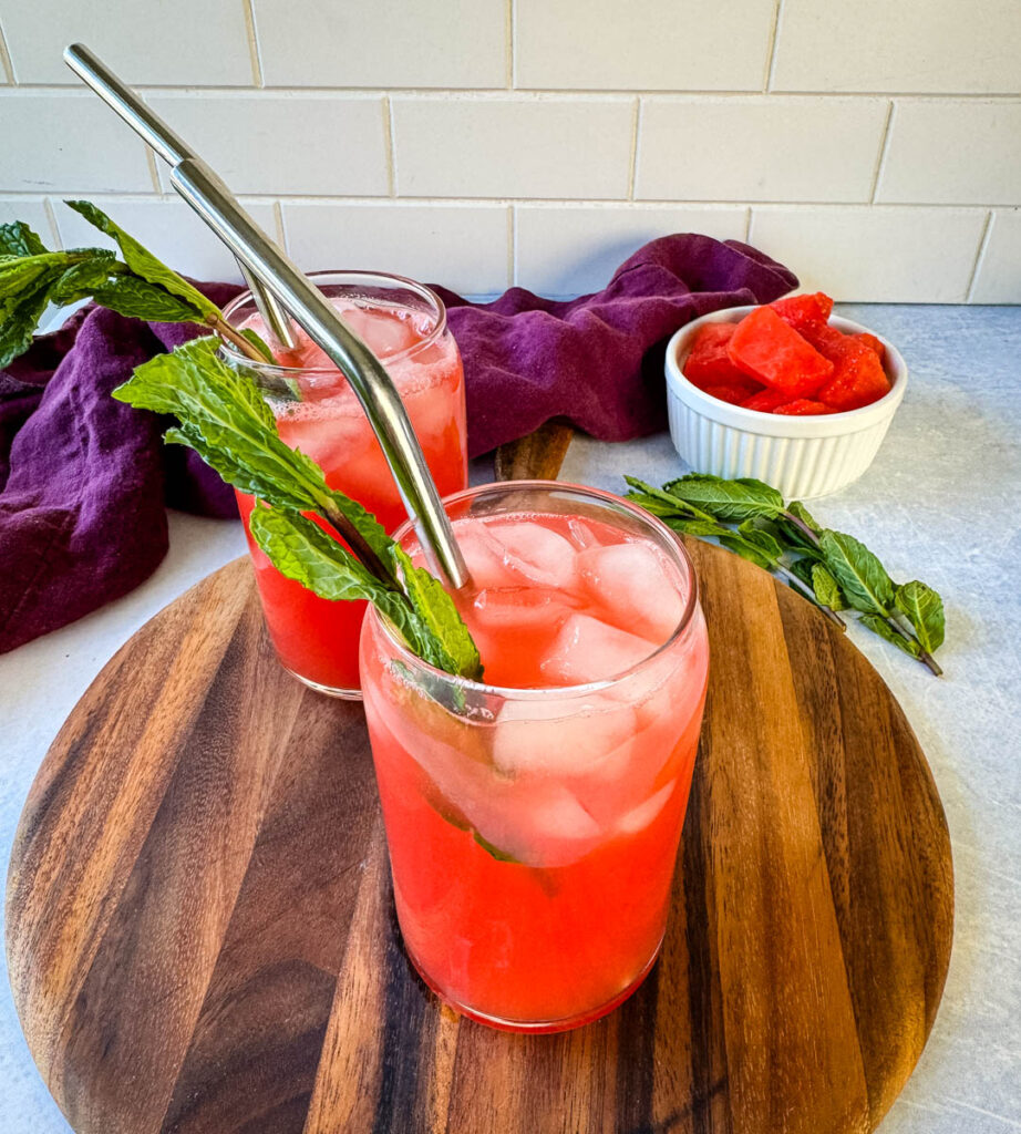 watermelon water in a glass with fresh mint and ice cubes