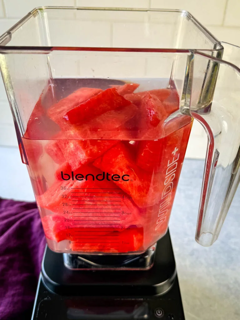 water and watermelon in a blender