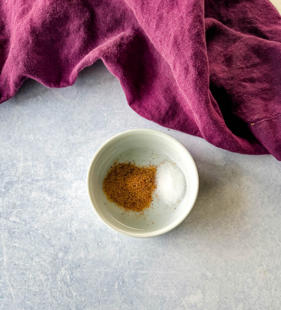 Cajun spices and salt in a white bowl