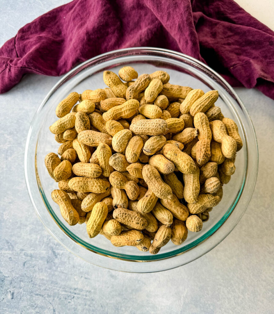 raw peanuts in a glass bowl