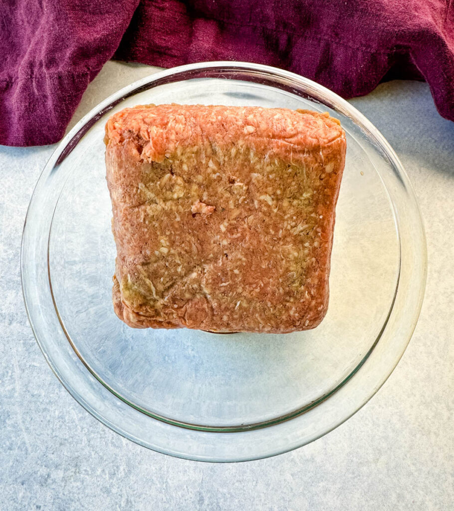 raw ground beef in a glass bowl