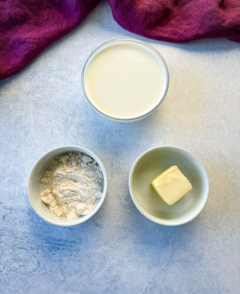 half and half or milk, flour, and butter in separate white bowls
