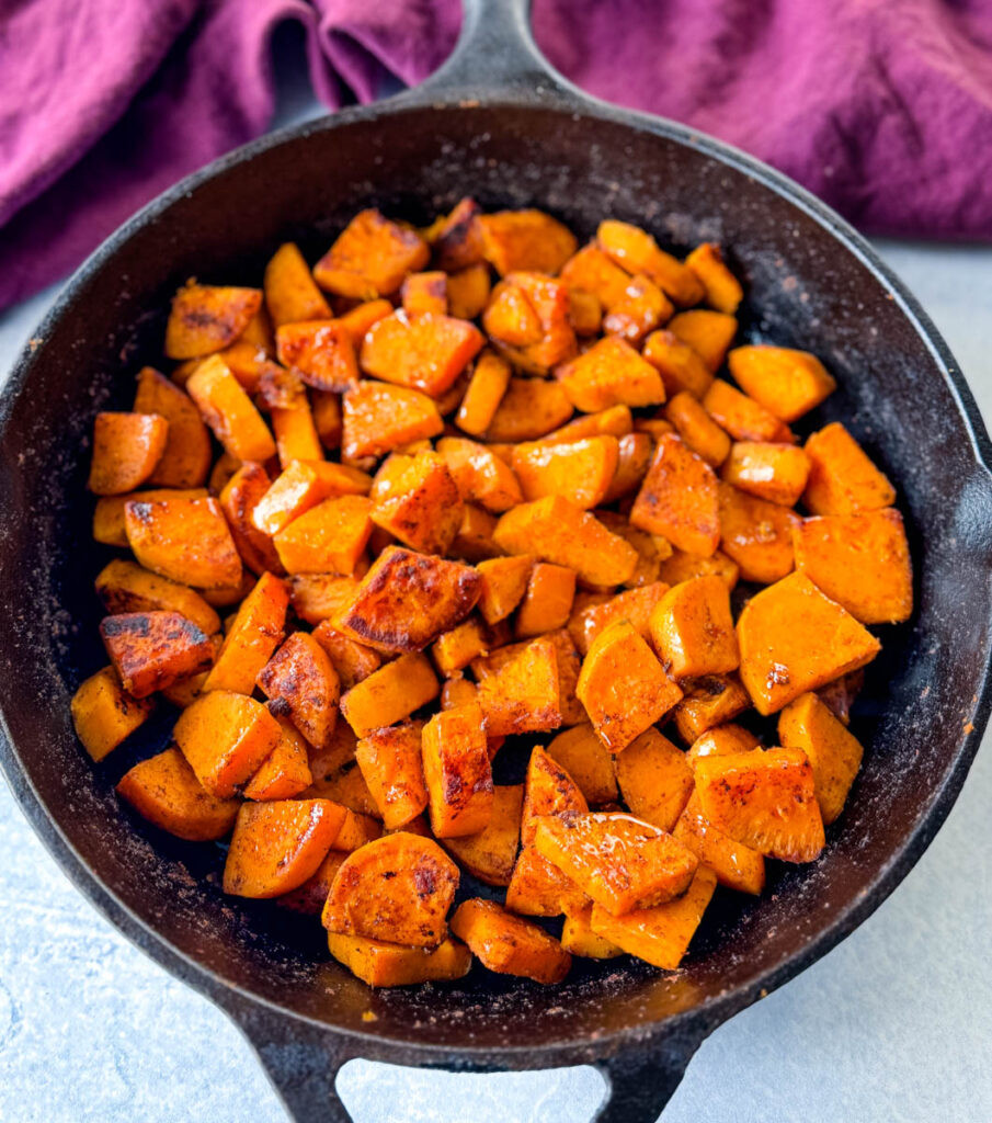fried sweet potatoes in a cast iron skillet