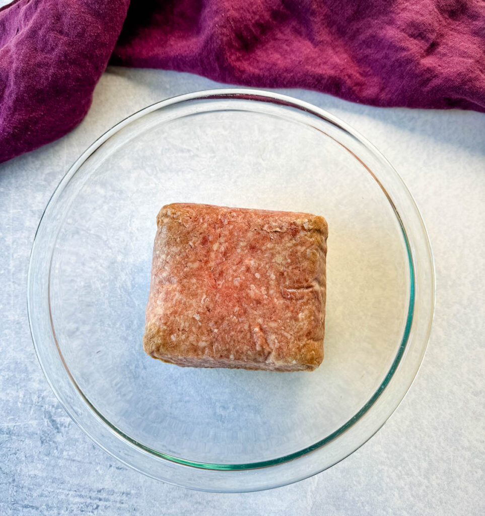 raw ground beef in a glass bowl