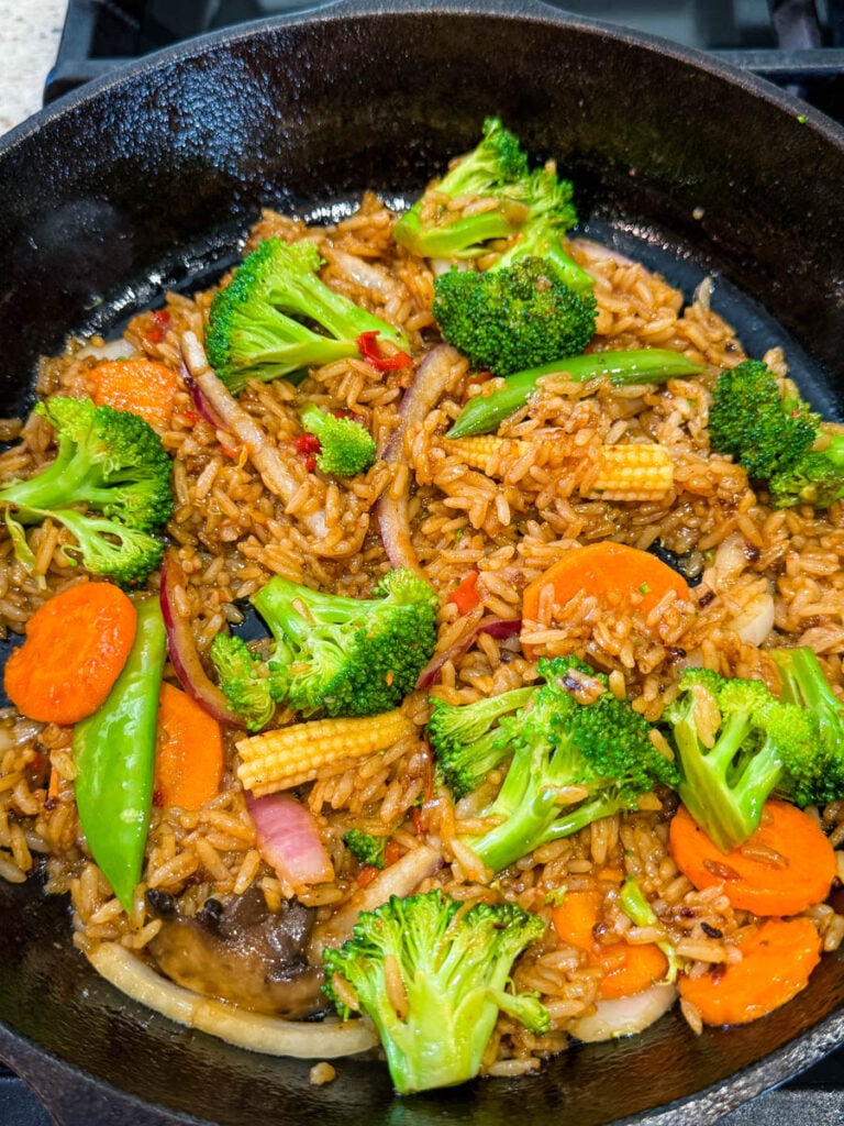 vegetables and fried rice in a cast iron skillet