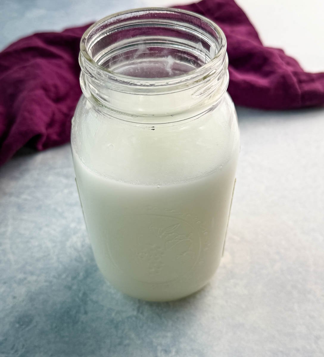 cream of coconut and water in a mason jar