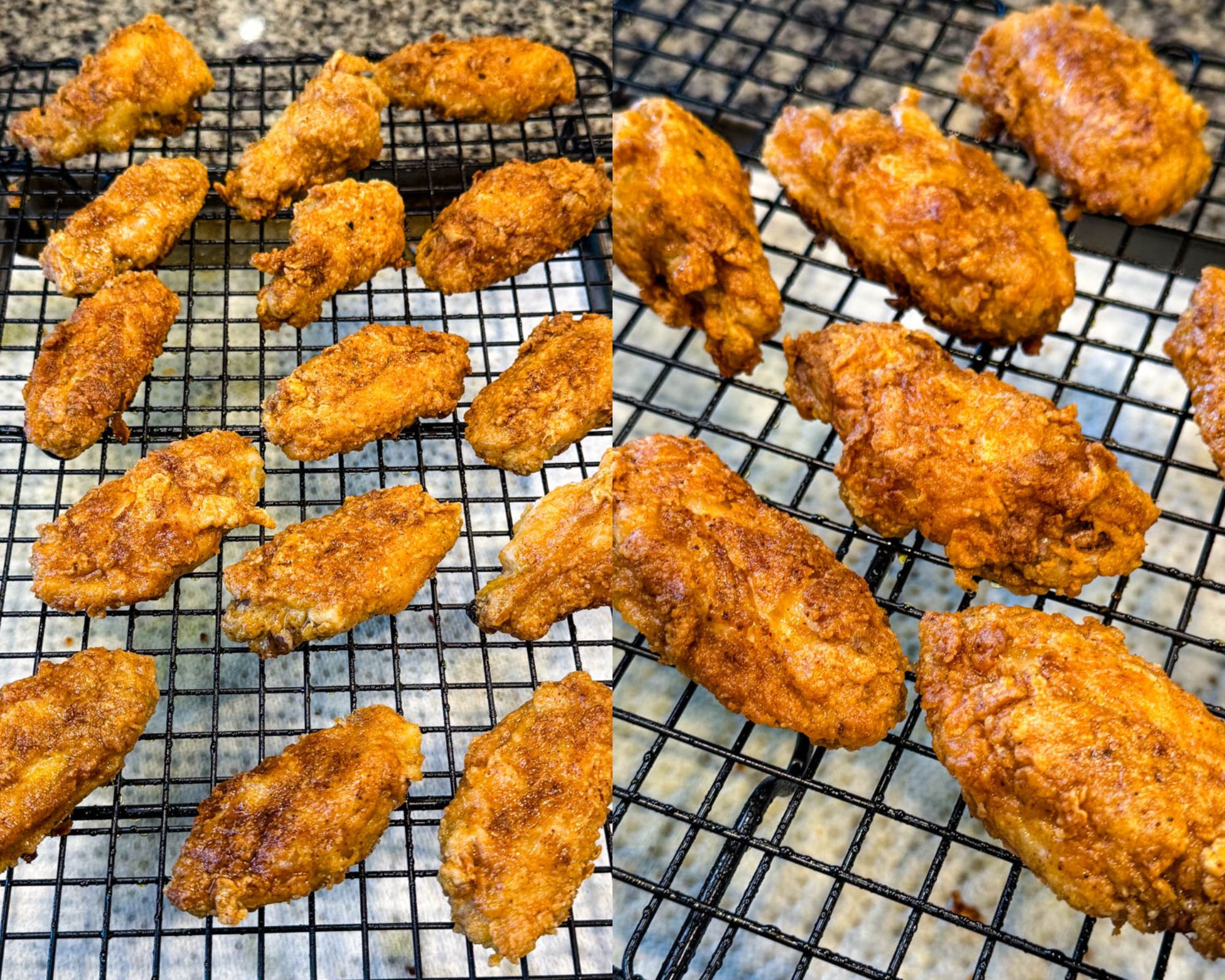 Crispy fried chicken wings resting on a black wire rack, cooling after frying.