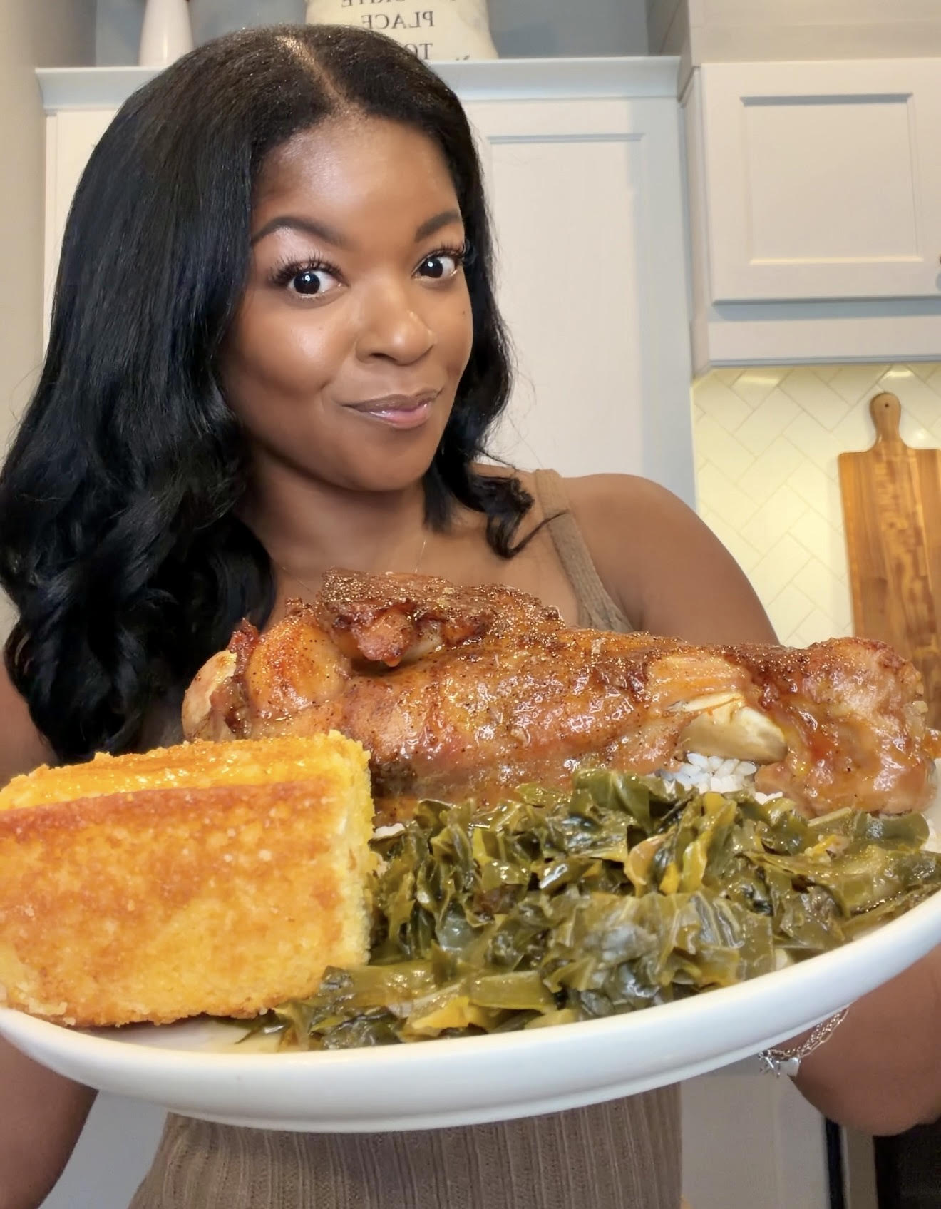 person holding a plate of baked turkey wings