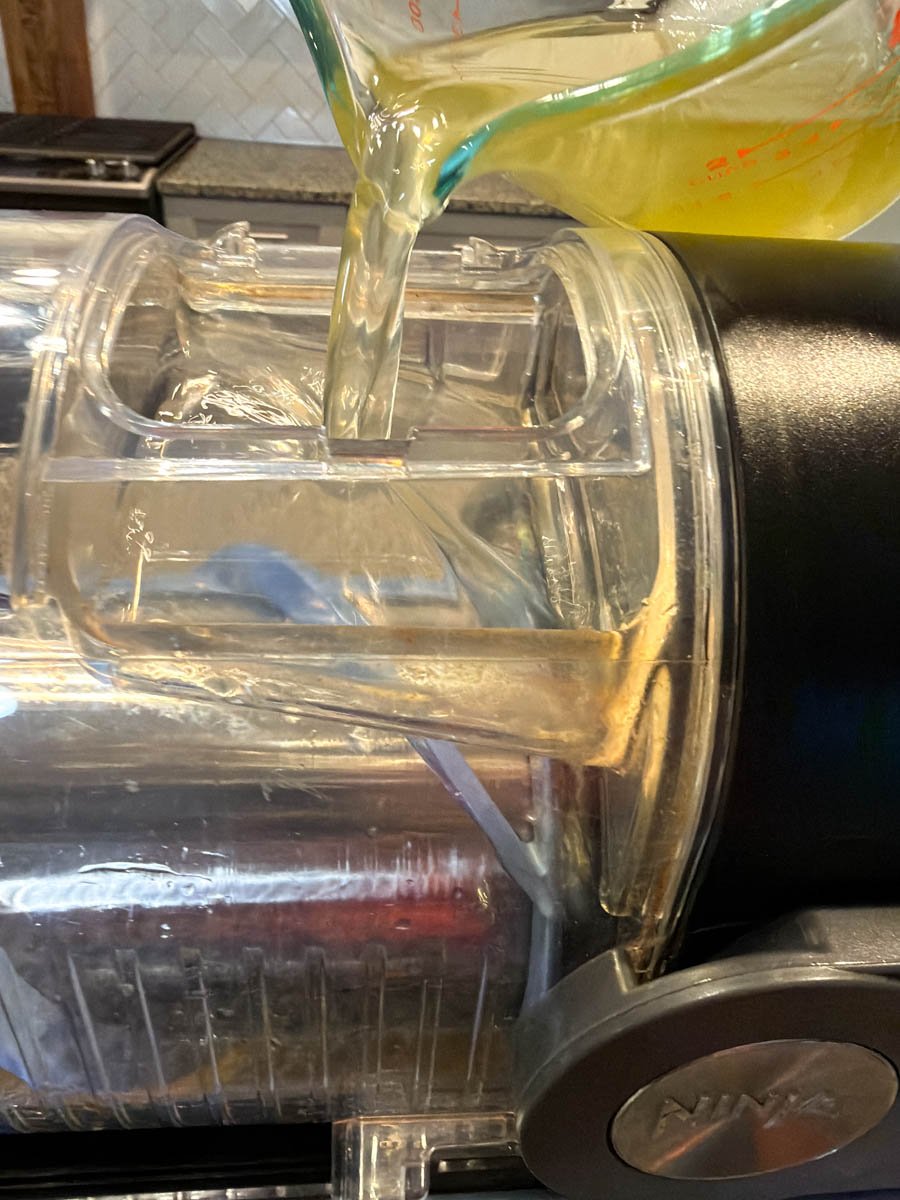 mojito being poured into Ninja Slushi machine